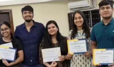 Ankur Agarwal with DMCG students holding certificates